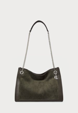 Suede handbag in dark green with a contrasting leather base, silver chain handle, and logo charm. Soft texture and curved shape.
