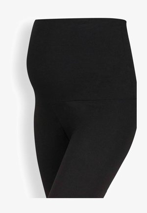 Zwarte elastische zwangerschapsleggingen met een hoge tailleband, ontworpen om een zwangere buik te ondersteunen.