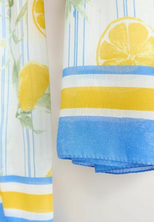 Cotton fabric featuring yellow lemons and blue or yellow stripes. The design includes green leaves and a hemmed edge.