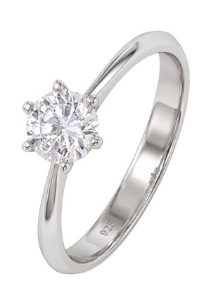 Silver ring with a single large round clear gemstone held by six prongs, ring band marked with "925" inside.