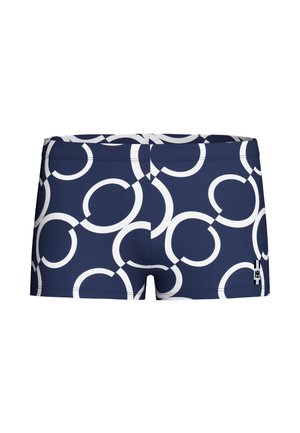 Tmavě modré plavky s bílými překrývajícími se kruhovými vzory a malou černo-bílou značkou v pravé dolní části.
