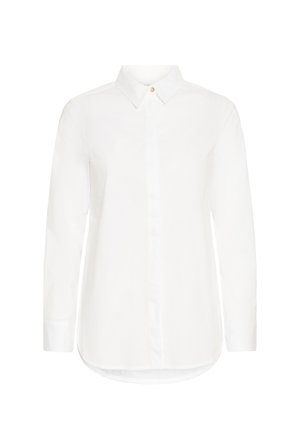 Vit långärmad skjorta i bomull med spetsig krage, framknäppning och rundad fåll. Har en enskild accent av en guldknapp.