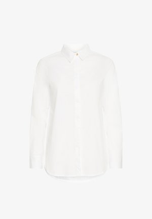 Vit långärmad skjorta i bomull med spetsig krage, framknäppning och rundad fåll. Har en enskild accent av en guldknapp.