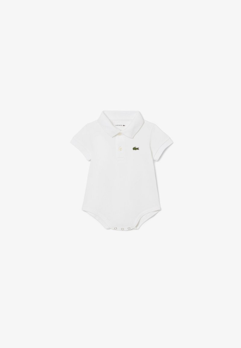 Body neonato bianco polo in cotone, con colletto classico, maniche corte e logo a coccodrillo ricamato verde sul petto.