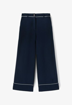 Marineblauwe wijde pantalons met witte bies op de manchetten en tailleband, knoopsluiting aan de voorkant en ceintuurlussen.