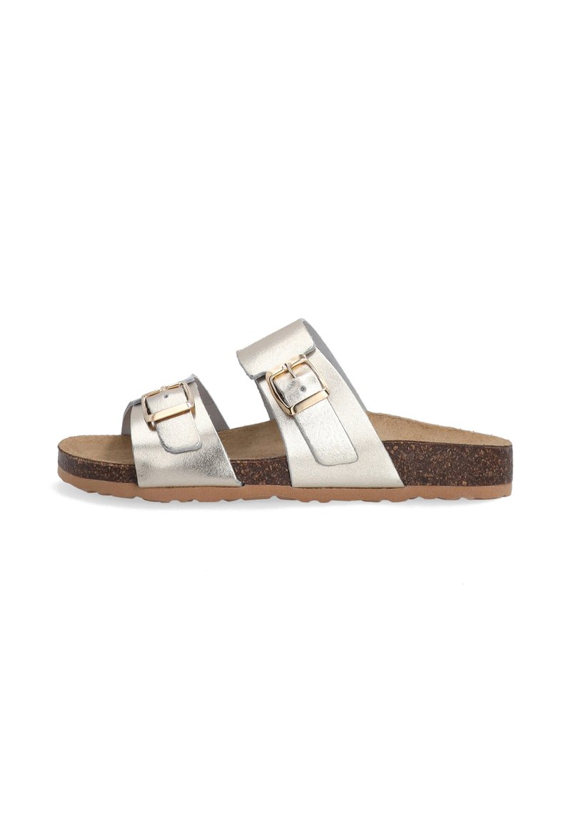 Silver metallic slide sandals with two adjustable buckles, cork sole, flat design, smooth texture, and a minimalist, open-toe style.