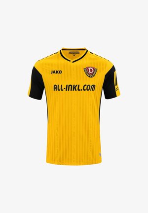Geel-zwart voetbalshirt met Dresden teamlogo, merknaam Jako en all-inkl.com sponsor tekst op de voorkant.