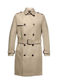 Trench-coat beige avec fermeture à boutons croisés, épaulettes et taille ceinturée ajustable. Texture lisse, longueur moyenne.