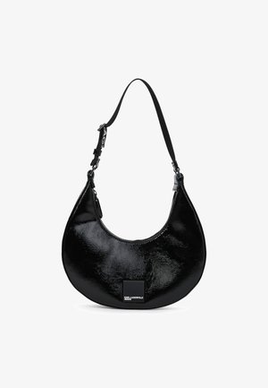 Black shiny patent leather crescent-shaped shoulder bag with adjustable strap and Karl Lagerfeld Jeans logo patch on front.