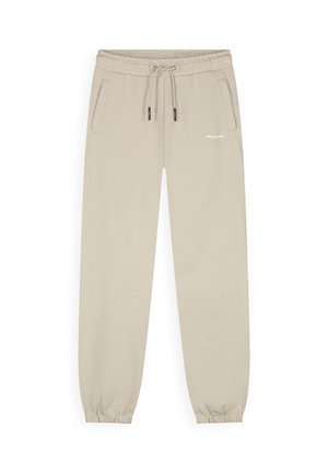 Beige joggerbroek met elastische tailleband, trekkoord, zijzakken, elastische boorden en klein wit "BALLIN" logo op de linker dij.