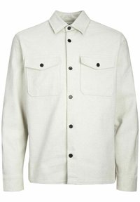 Camisa de botones de color claro hecha de tela texturizada, con dos bolsillos en el pecho, botones negros y un cuello clásico.
