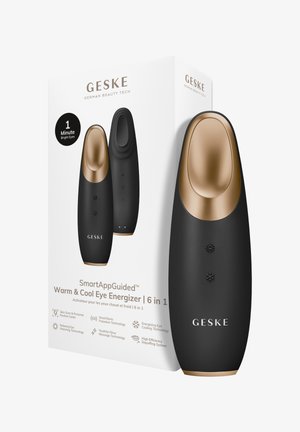 Appareil énergisant pour les yeux GESKE noir et or avec des boutons pour chauffer et refroidir, affiché à côté de sa boîte produit blanche avec texte et icônes.