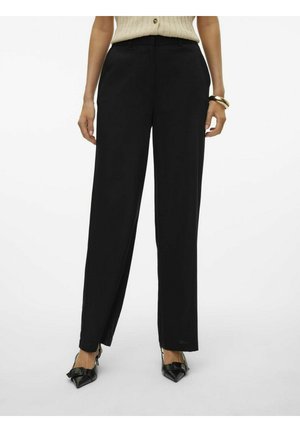 Pantalons noirs à jambes larges en tissu doux. Dotés d'un pli sur le devant, d'une taille plate à l'avant et de poches latérales élégantes.