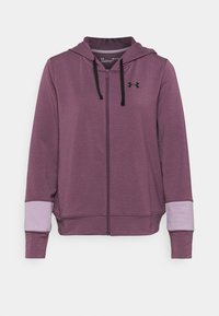 Fialová mikina na zip s kapucí, černými šňůrkami a světle fialovými akcenty na rukávech. Vyrobena z hladké, strukturované látky.