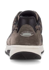 Dark brown suede athletic shoe with a smooth black leather upper, leopard print accents, and white rubber sole featuring textured grip.