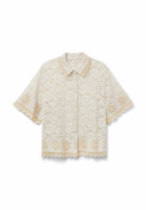 Kortærmet cremefarvet blondebluse med blomsterprint, knapper foran, bølgede kanter og dekorative broderede bånd på ærmer og kant.