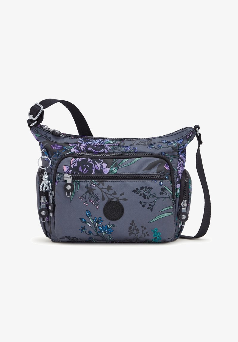 Harmaa kangasolkaiminen laukku, jossa on violetein ja sinivihrein kukkakuviot, kaksi vetoketjullista lokeroa ja irrotettava olkahihna.