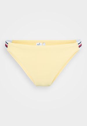 Žuti donji dio bikinija s rebrastom teksturom, u niskom dizajnu i višebojnim prugastim detaljima na pojasu.