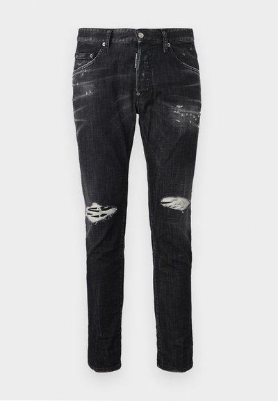 Μαύρο τζιν slim-fit με φθαρμένες λεπτομέρειες και σκισίματα και στους δύο γόνατους, εμπρόσθιες τσέπες και κούμπωμα με κουμπί στη μέση.