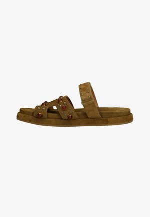 Brown suede sandal with two straps, one decorated with round studs and beads, flat sole, and an open toe design.