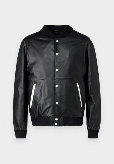 Black leather bomber jacket with a ribbed collar, white snap buttons, and side pockets featuring white accent zippers. Smooth texture and fitted cuffs.