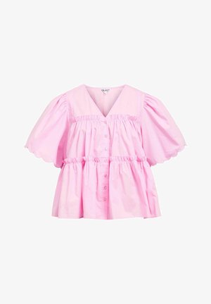 Blouse rose avec un décolleté en V, des manches courtes bouffantes, un ourlet festonné et un devant boutonné. Fabriquée en coton léger avec une coupe ample et froncée.