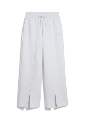 Jogging en gris clair avec une taille élastique, un cordon de serrage et des fentes sur les côtés. Présente un logo discret sur le bas de la jambe pour le marquage.