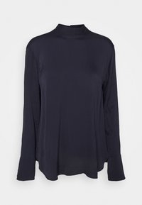 Camicia a maniche lunghe di colore blu navy scuro con colletto alto e un delicato motivo testurizzato. Realizzata in tessuto leggero con una vestibilità ampia e orlo arrotondato.