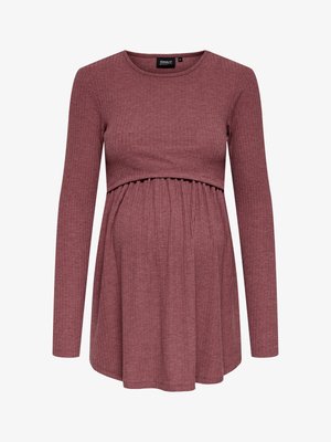 Porcelánrózsaszín hosszú ujjú bordázott kismama felső, réteges kialakítással, amelynél a felső rész testhez simuló, az alsó rész pedig bővebb, gyűrt fazonú.