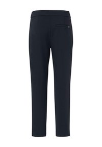 Pantalon bleu marine ajusté avec une texture lisse, présentant une coupe slim, une taille élastique et une unique poche arrière avec un bouton.