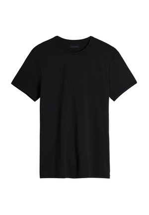 Schwarzes T-Shirt mit kurzen Ärmeln aus weicher Baumwolle, mit rundem Halsausschnitt und lockerem Schnitt sowie geradem Saum.