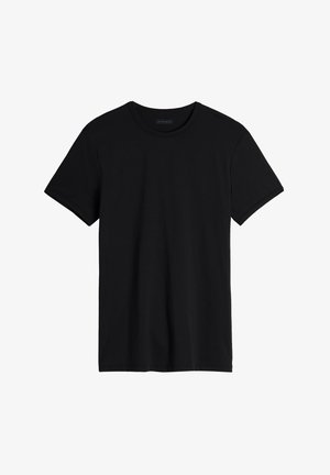 Černé tričko s krátkým rukávem vyrobené z měkké bavlny, s kulatým výstřihem a uvolněným střihem se rovně střiženým lemem.