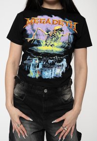 Black cotton t-shirt featuring a colorful graphic of a skeleton and characters in a dark scene, with “MEGADETH” text at the top.
