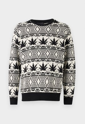 Pleteni pulover z črno in kremno geometrijskim vzorcem ter motivi listov, okroglim izrezom in rebrastimi manšetami ter robom. Mehak tekstilni zaključek.