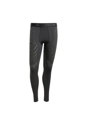 Zwarte sportleggings met een strakke pasvorm, voorzien van een textuurpatroon aan de zijkanten en een merk-elastische tailleband gelabeld "TECHFIT."