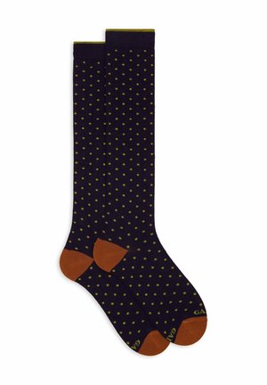 Navy blue knee-high socks with olive green polka dots and brown toes, heels, and cuffs laid flat side by side.