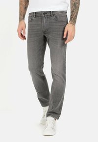 Grå denim jeans med en slim fit design, fem lomme stil, kontraststing og knaplukning i taljen.