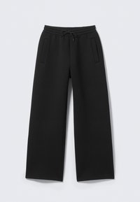 Schwarze Jogginghose mit weitem Bein, ausgestattet mit einem Kordelzugbund und zwei Seitentaschen. Hergestellt aus einem weichen, strukturierten Stoff.