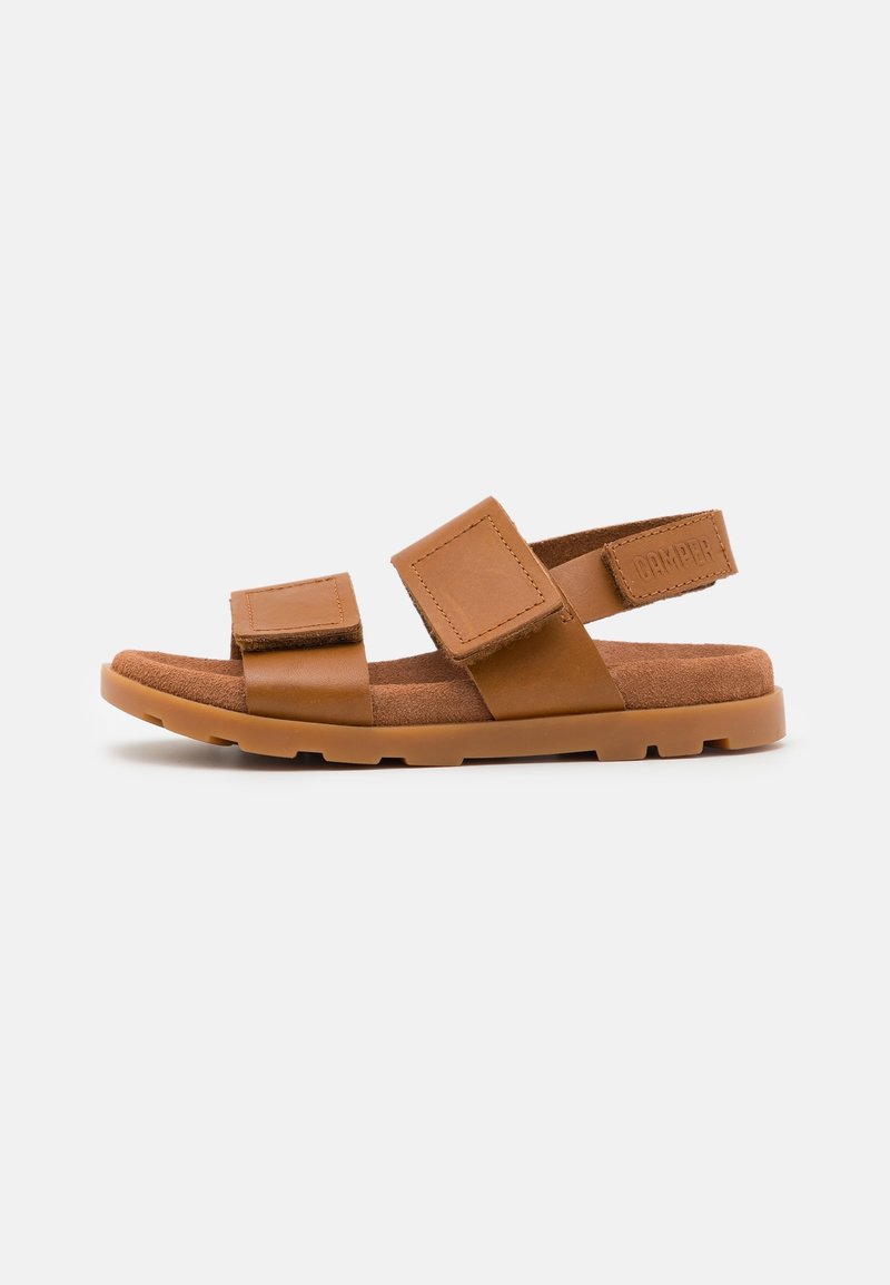 Brown leather sandals with two adjustable straps, a suede footbed, and a textured rubber sole for grip. Features a rectangular logo accent.