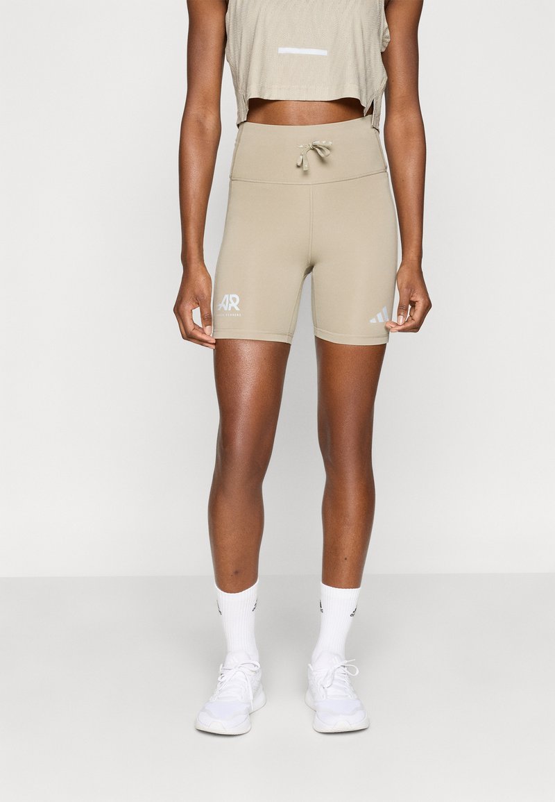 Μπεζ αθλητικές σορτς με ψηλή μέση από λείο ύφασμα, με κορδόνι στη μέση, λογότυπα και εφαρμοστή γραμμή.
