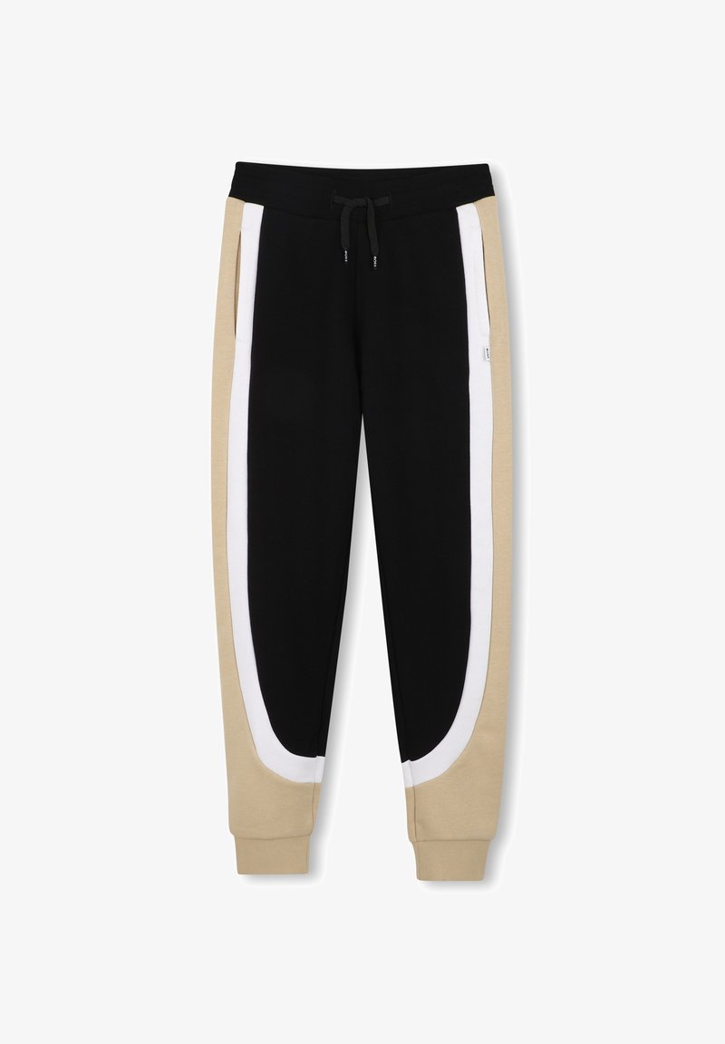 Pantalon de jogging noir avec côtés extérieurs beiges et bandes blanches incurvées, doté d'une ceinture élastique et d'un cordon de serrage.