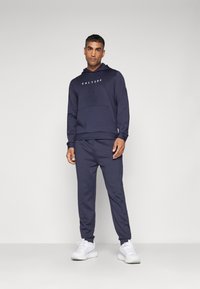 Castore SCUBA JOGGERS - Tracksuit bottoms - midnight navy