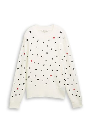 Weißer Pullover mit schwarzen Punkten und verstreuten roten Herzen. Strickgewebe, Rundhalsausschnitt, lange Ärmel, gerippte Bündchen und Saum.