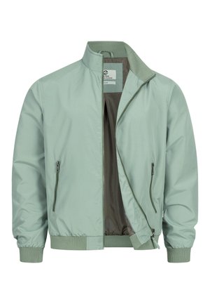 Light green bomber jacket with ribbed cuffs and hem, front zipper partially open, and zippered side pockets.