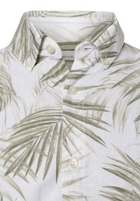 La camicia a maniche corte con colletto presenta un tessuto bianco con motivi di foglie di palma verde chiaro, bottoni in plastica e una finitura texturizzata.