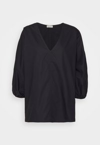 Blusa nera in cotone con scollatura a V profonda, maniche ampie e vestibilità rilassata. Presenta una cucitura centrale e polsini arricciati.