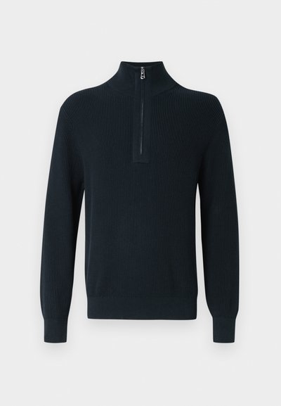 Pull-over en maille côtelée bleu marine foncé avec col montant zippé et manches longues. Comprend des poignets et un ourlet ajustés pour un ajustement près du corps.
