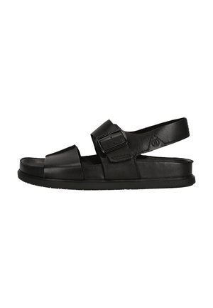 Sandales en cuir noir avec une semelle plate, une sangle à boucle et un design ouvert avec un espace pour les orteils. Les sangles offrent des options d'ajustement.