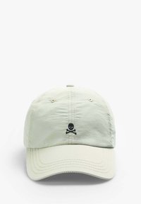 Light green cap made of soft fabric, featuring a black skull and crossbones emblem at the front, with stitched detailing and a curved brim.