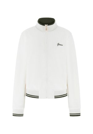 Veste zippée blanche avec une texture côtelée, un col et des poignets en accent vert, et un logo brodé subtil sur la poitrine gauche.